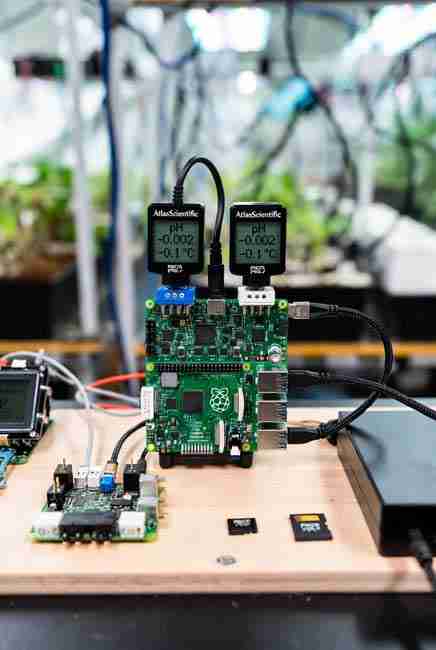 A relay being added to a raspberry pi set up for scaling up automation in a growroom