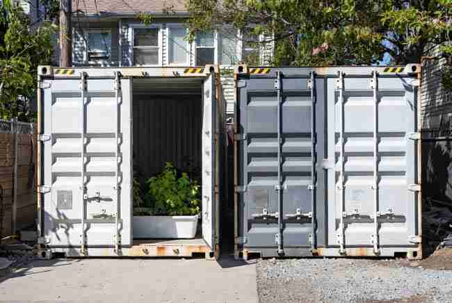 Two side-by-side shipping containers showing scalable modular cannabis growing expansion potential for home growers