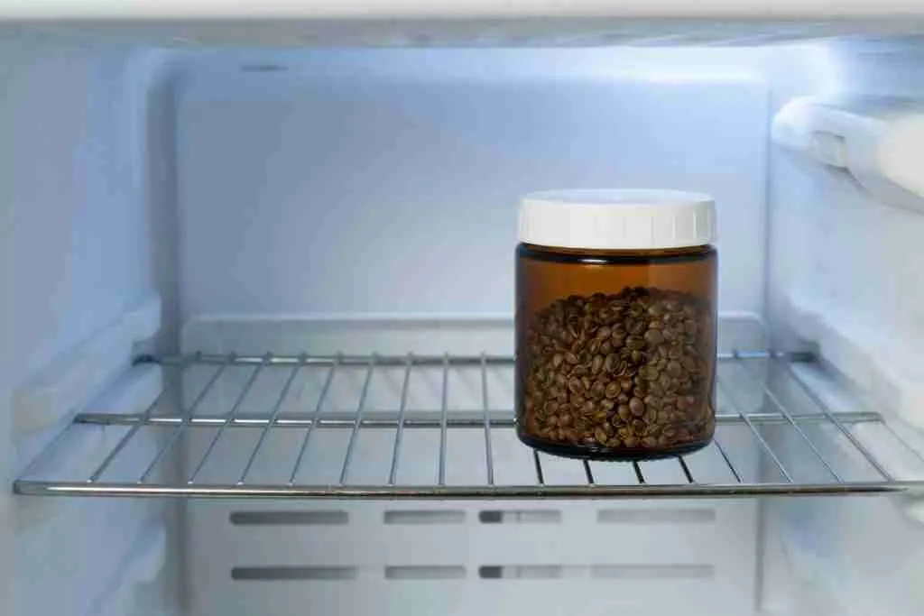 An amber jar on a back shelf of a refrigerator